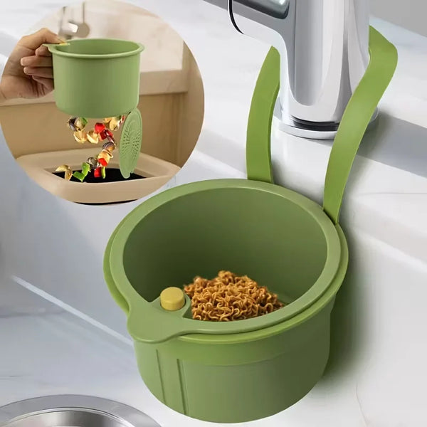 Grüner Press-Abflusskorb mit Sieb und Lebensmittel in einer Küchenspüle.