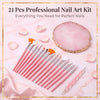 A pink professional nail art kit featuring brushes, dotting tools, and a natural pink palette on a marble background.