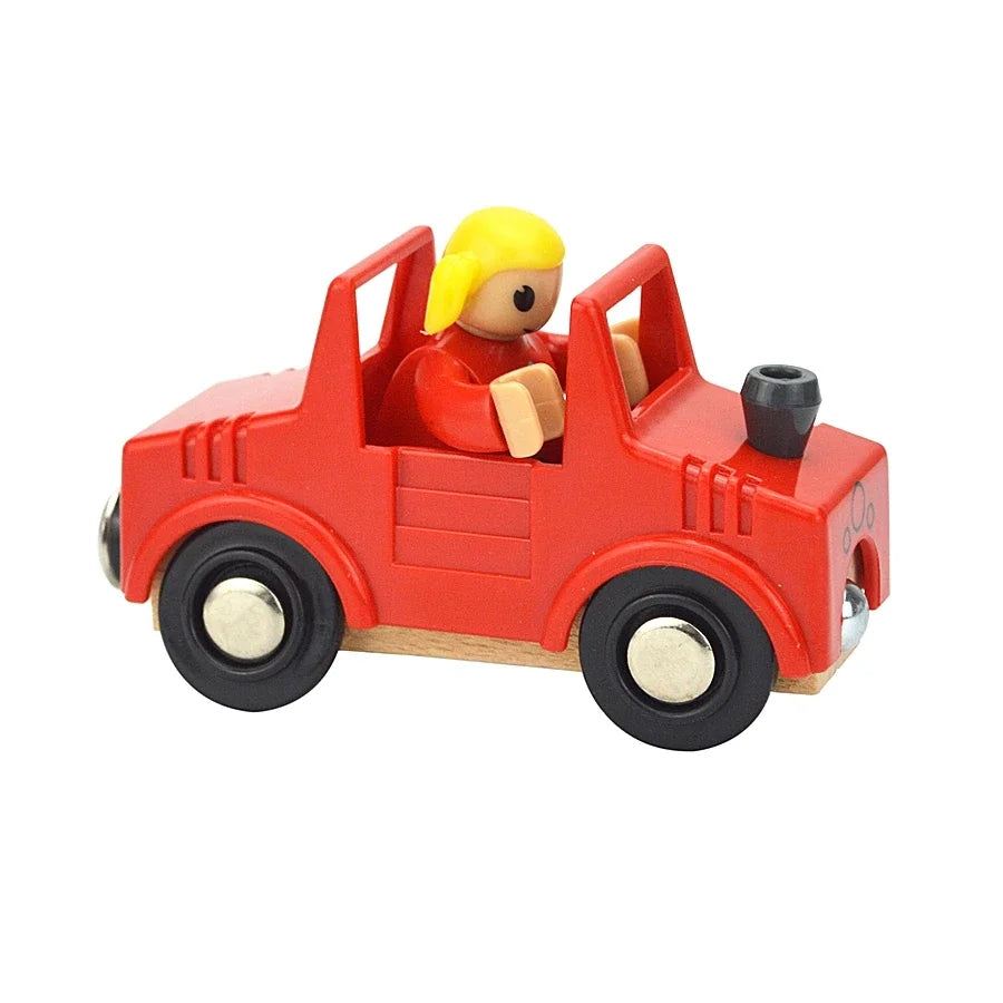 A red wooden magnetic train car set with a yellow figure and black wheels.