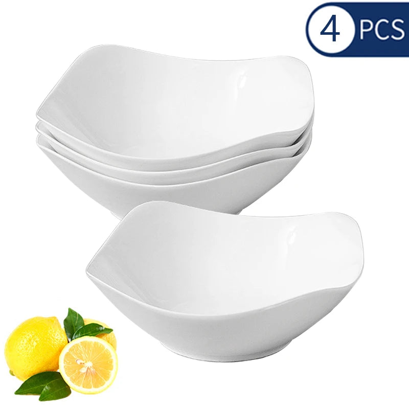 A set of four white reusable PP salad bowls is shown next to a lemon slice.