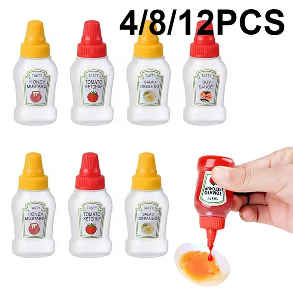 Set von vier Mini-Squeeze-Flaschen in Gelb und Rot, darunter Honigsenf, Tomatenketchup, Salatdressing und