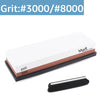 A set of two dual-sided knife sharpening stones, labeled Grit 3000 and 8000, shown with a black base.