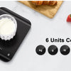 A black digital kitchen scale is shown measuring a white substance, with various units like kg, lb, ml, oz, and milk displaye