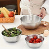 A stainless steel mixing bowl set with a measuring scale is shown next to fresh ingredients like tomatoes and corn.