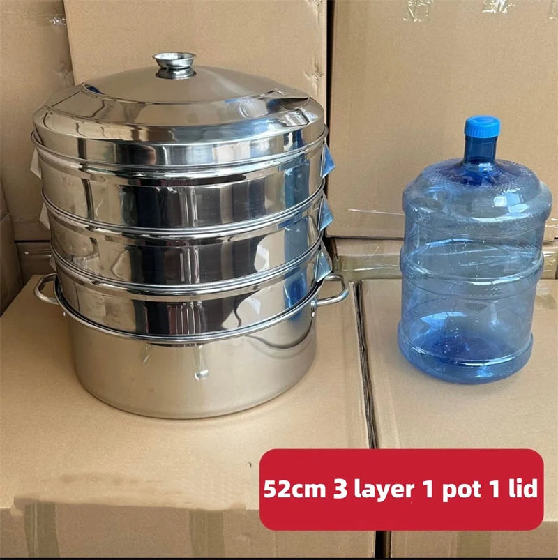 A stack of three stainless steel pots with lids and a separate blue plastic bottle are shown on a cardboard box.