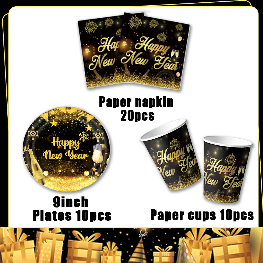 A set of gold and black New Year themed paper napkins, plates, and cups for a party.