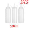 Three white multi-use squeeze condiment bottles with black caps and droppers, labeled 500ml.