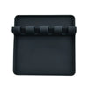 Black silicone utensil drying rack organizer with a slotted tray for drying utensils.