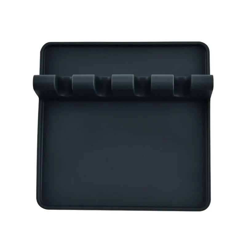 Black silicone utensil drying rack organizer with a slotted tray for drying utensils.
