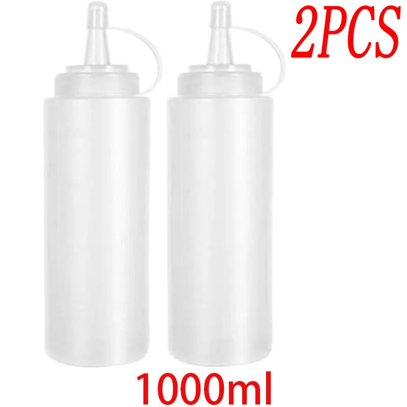 Two white 1000ml squeeze condiment bottles with droppers