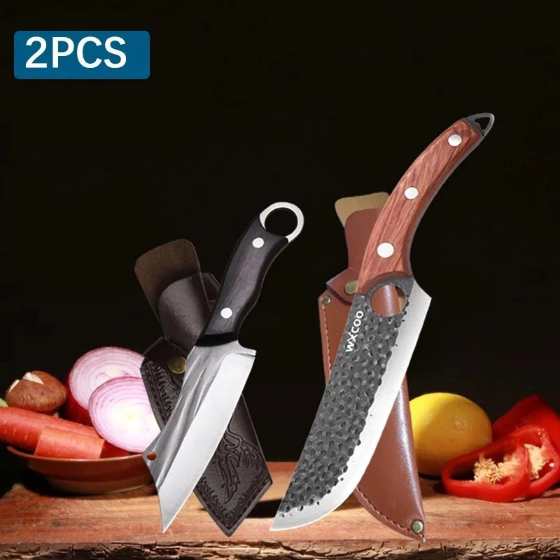 A set of two handmade forged butcher and chef knives with wooden handles displayed on a wooden surface.