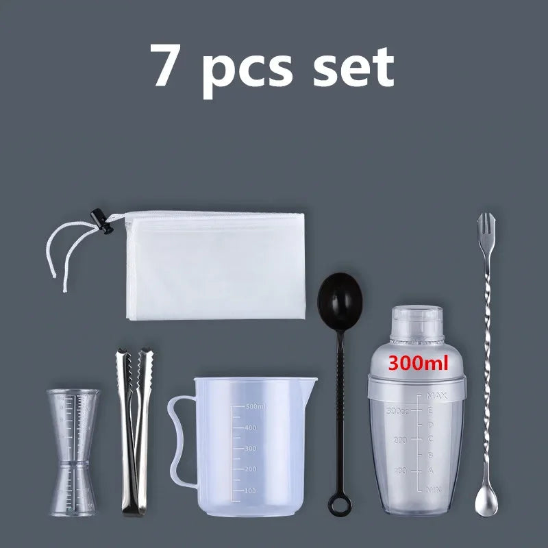 A set of seven plastic cocktail tools including a shaker, strainer, and measuring cup.