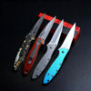 A set of three multi-functional folding utility knives with colored handles displayed on a red box.