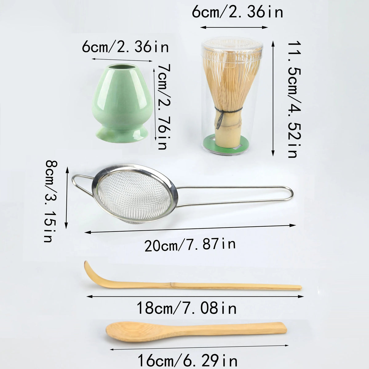 A set of natural bamboo tea tools including a green ceramic cup, a bamboo whisk, a metal strainer, and wooden spoons.