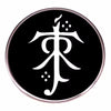 A round black enamel pin featuring a white stylized symbol on a silver-toned metal background.