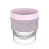A stackable food-grade ice mold with a pink top and clear base.