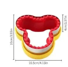 A yellow geometric sandwich cutter and sealer set with a red interior mold.