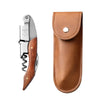 A silver and brown double-hinged waiter's corkscrew with a leather sheath and foil cutter.