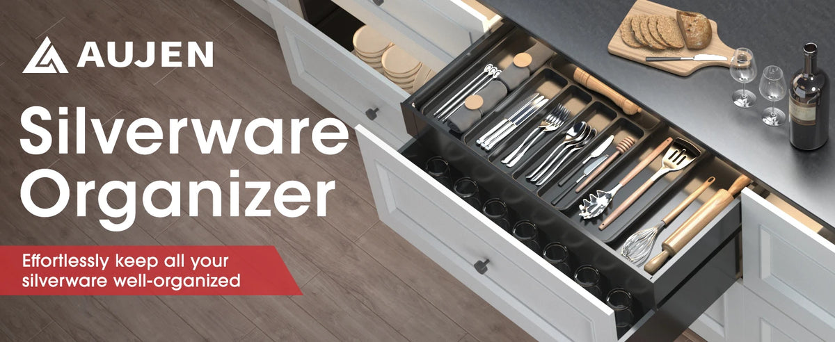 A wooden and silver silverware organizer displayed inside a kitchen cabinet drawer.
