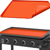 Orange silicone BBQ baking mat resting on a black grill or cooking surface.