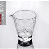 A clear, textured glass teapot or pourer is shown against a white background.
