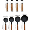 A set of stainless steel measuring spoons with wooden handles, showing various volumes from 1.25ml to 250ml.