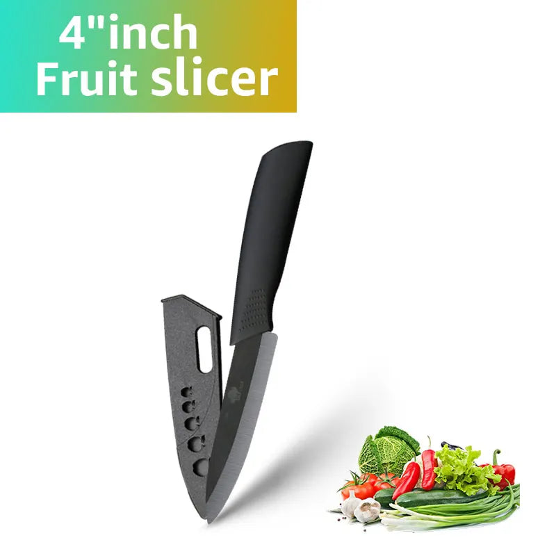 A black 4-inch fruit slicer knife next to various fresh vegetables like broccoli, lettuce, and peppers.