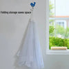 White mesh food covers hanging on a wall, demonstrating space-saving folding storage.