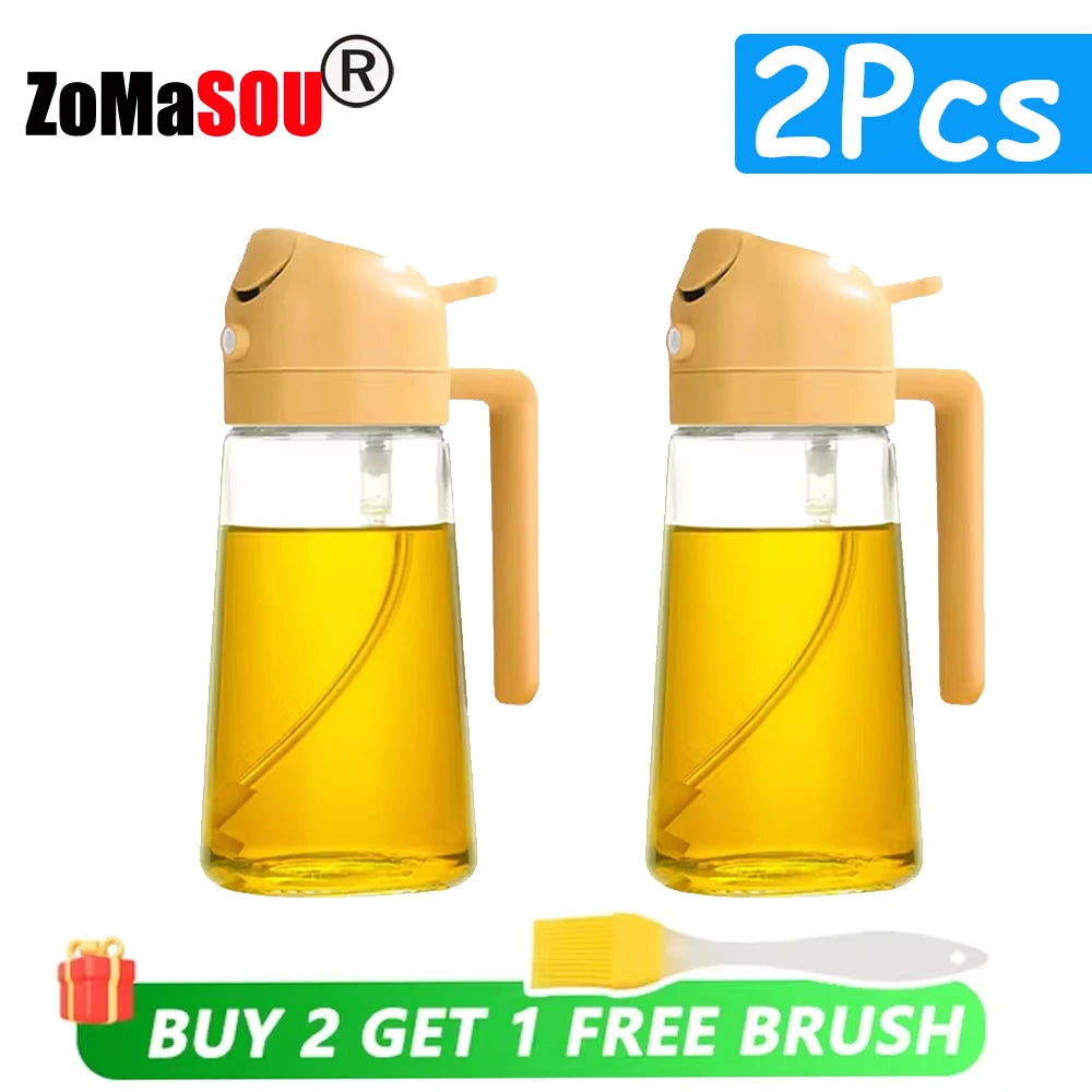 Two amber glass oil sprayer bottles with orange-colored pumps and a free brush included.