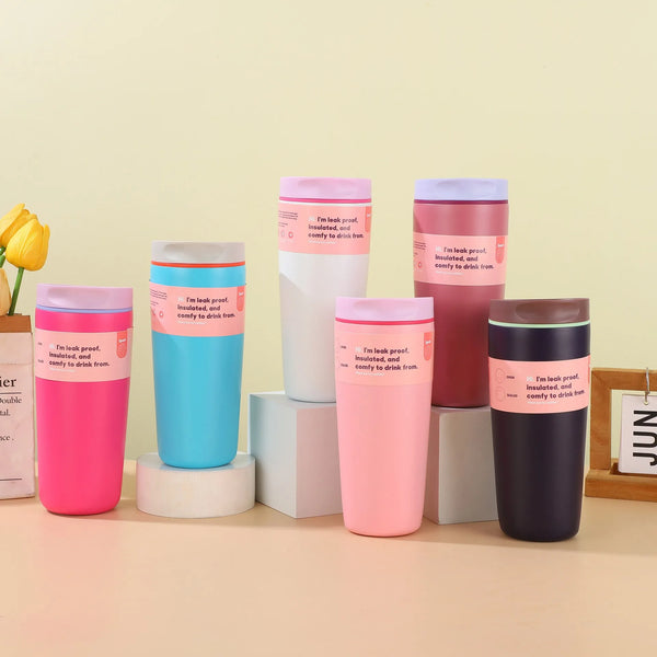 A collection of pink, blue, and purple 304 stainless steel vacuum coffee mugs displayed on a light surface.