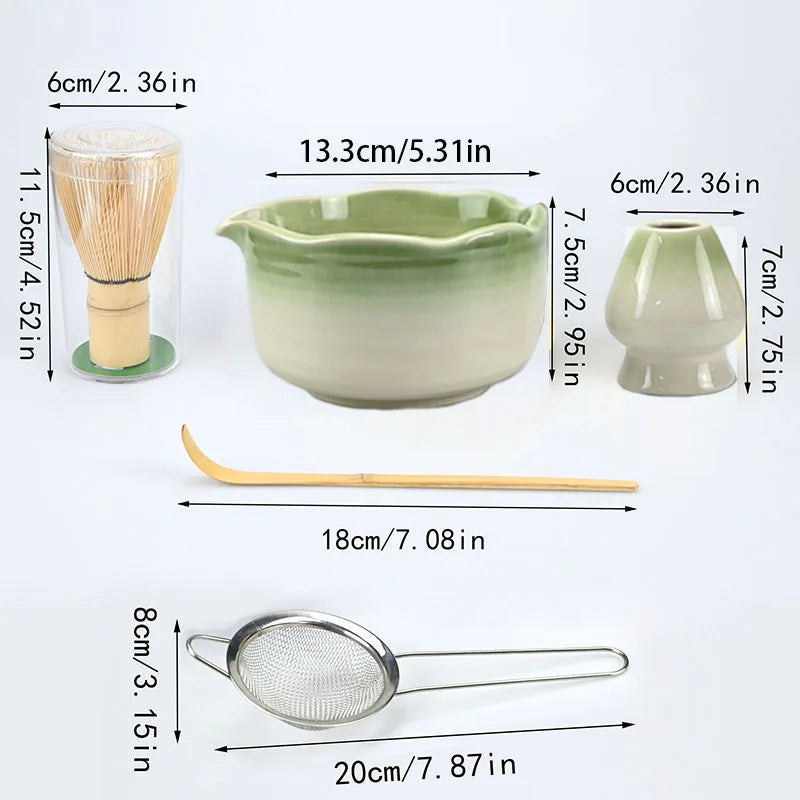 A set of Japanese style matcha bowls and bamboo brushes with accompanying mesh spoons shown in various sizes.