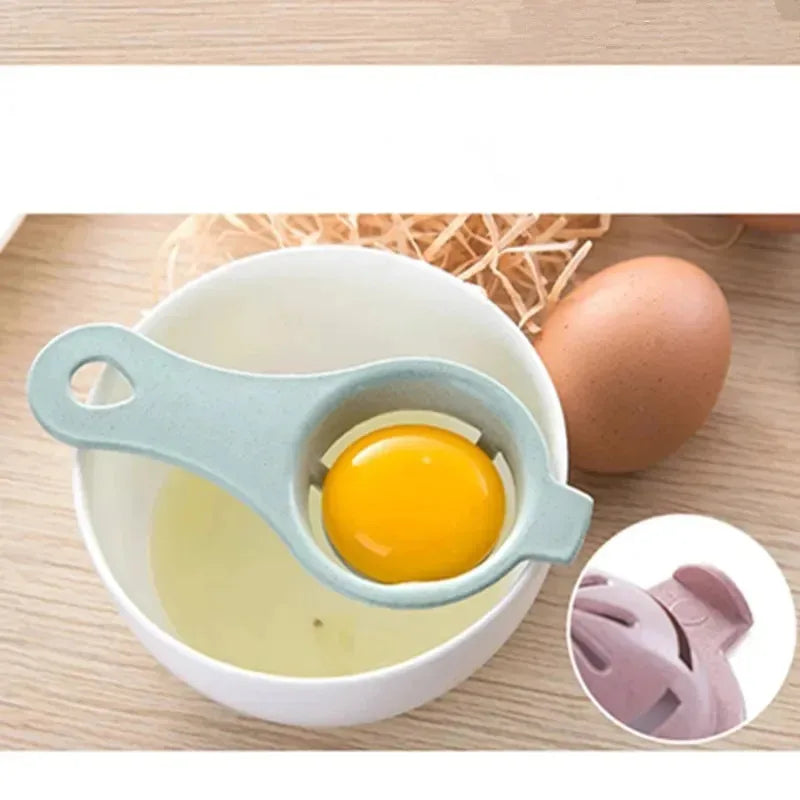 A multi-piece egg white and yolk separator set showing a yellow egg in a silicone tool over a white bowl.