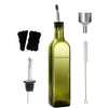 A set of elegant glass oil and vinegar dispensers including a bottle, a pourer, and a metal measuring cup.
