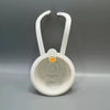 White press-type drain basket with a handle, used for kitchen or bathroom drainage.