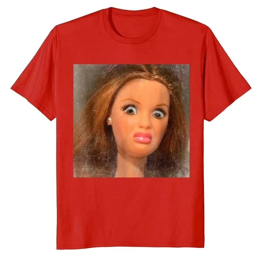 A red t-shirt featuring a close-up image of a disfigured face meme.
