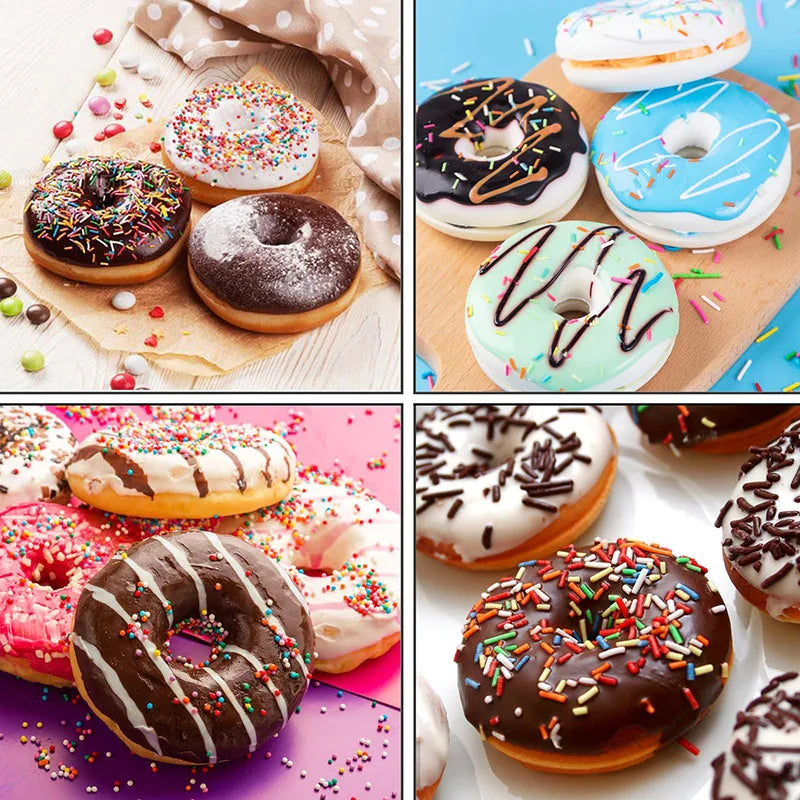 A collection of colorful frosted donuts and glazed donuts displayed on a wooden surface.