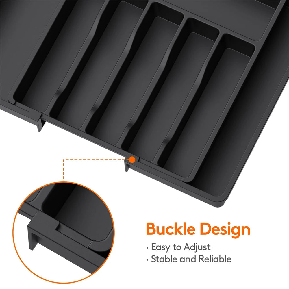 A black adjustable plastic flatware organizer tray with a buckle design shown in detail.