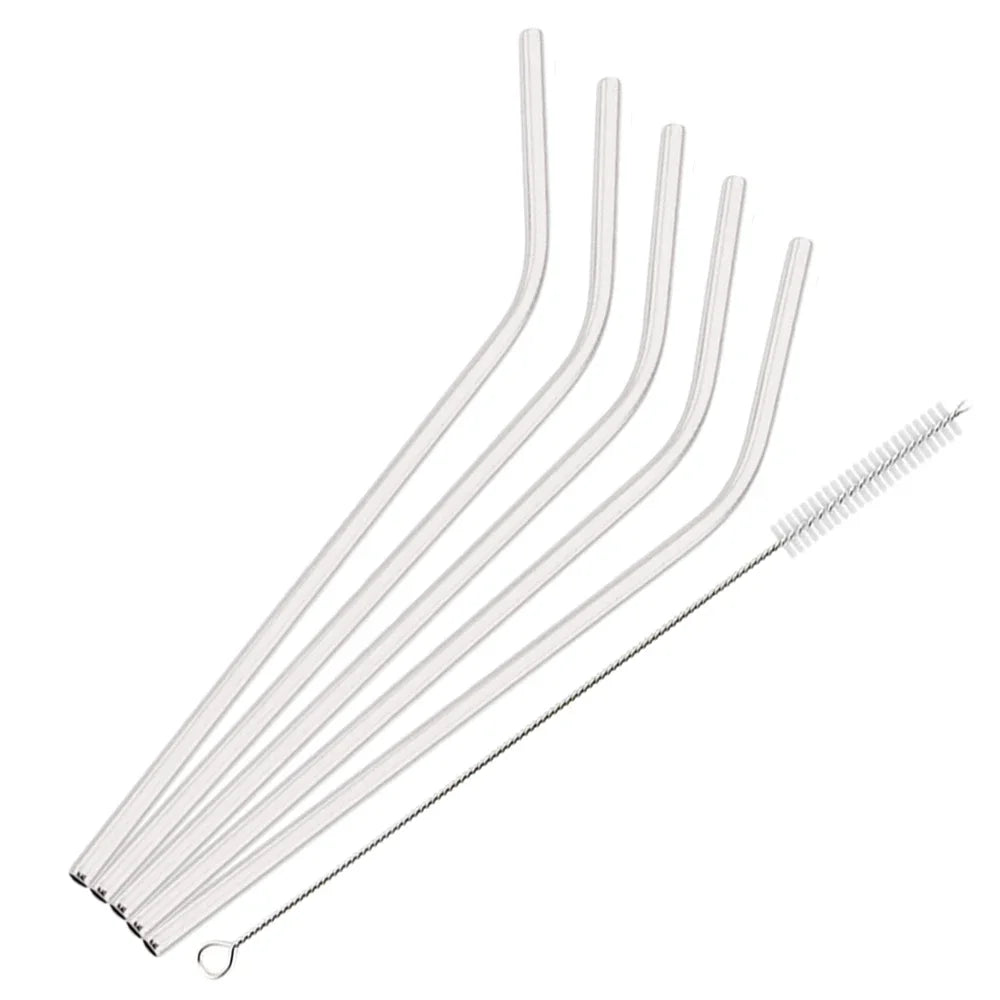 A set of six clear reusable stainless steel drinking straws arranged diagonally.