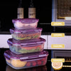Stack of purple and clear airtight refrigerator storage boxes with various liquid measurements labeled