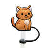 An orange cat silicone straw cover attached to a white stick.