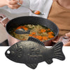 A black reusable iron fish kitchen accessory used for cooking or serving.