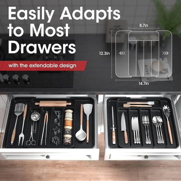 A close-up view of an expandable silverware drawer organizer with various kitchen utensils stored in compartments.