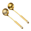 A set of golden stainless steel hot pot colanders with perforated bowls.