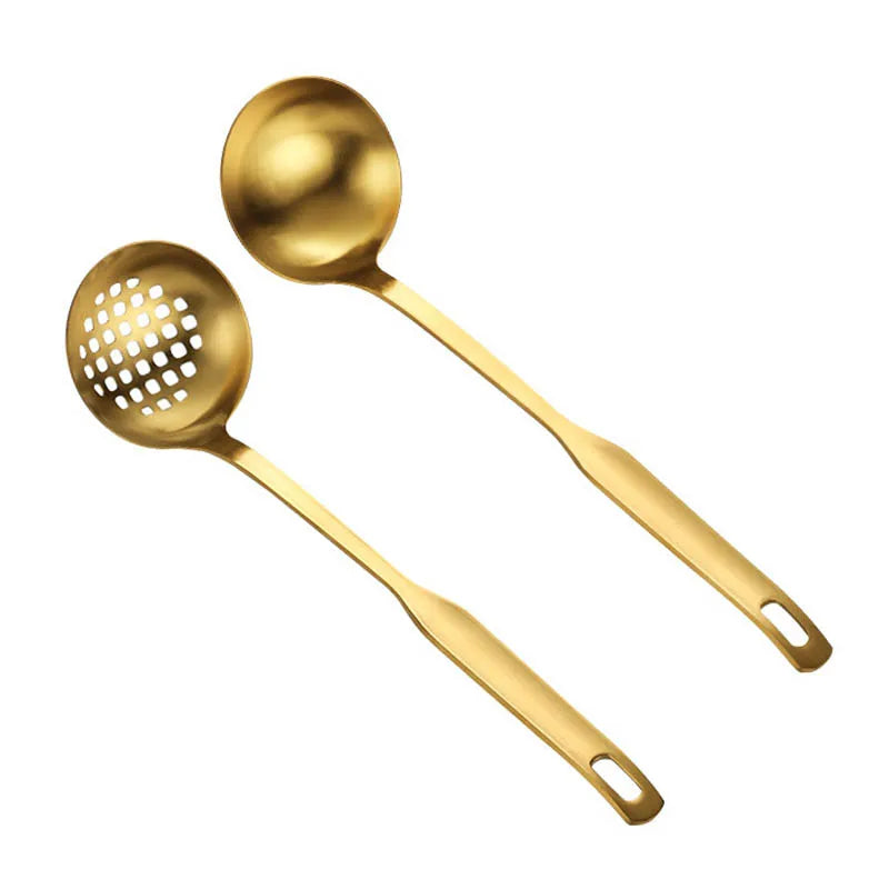 A set of golden stainless steel hot pot colanders with perforated bowls.