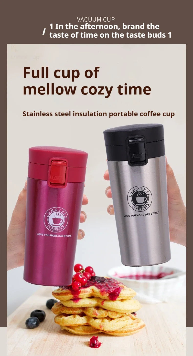 A pink vacuum cup and a silver vacuum cup are shown next to a stack of cookies on a wooden surface.
