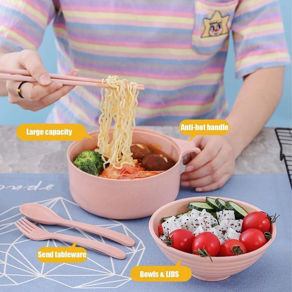 A person is preparing microwave ramen in a pink pot with noodles and toppings, surrounded by utensils.