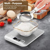 A digital kitchen scale is shown measuring white powder ingredients like flour or sugar, with eggs and tomatoes nearby.
