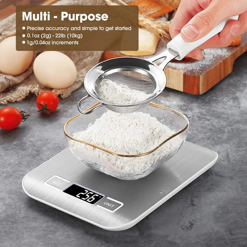 A digital kitchen scale is shown measuring white powder ingredients like flour or sugar, with eggs and tomatoes nearby.