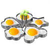 Stainless steel heart and egg mold set with cooked eggs and green spheres