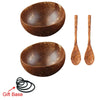 A set of three natural coconut shell serving bowls and two matching wooden spoons with a gift base.
